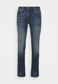 Jean en denim bleu avec une coupe droite, taille mi-haute, style à cinq poches et légèrement délavé à l'avant pour un look usé.