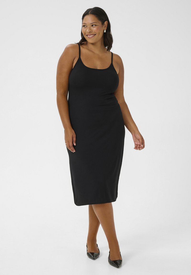 Abito midi nero senza maniche con una silhouette aderente, realizzato in tessuto morbido. Sottolinea la forma del corpo con dettagli di design minimi.