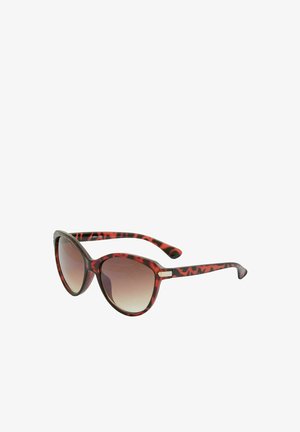 Lunettes de soleil œil de chat en écaille avec verres marron dégradés et branches fines, inclinées pour montrer les détails du côté droit et de la monture avant.