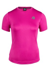 Getailleerde t-shirt met korte mouwen in een levendige roze kleur, gemaakt van zachte stof. Voorzien van een klein grijs logo op de borst en een ronde halsontwerp.