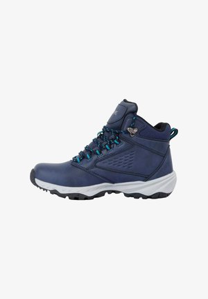 Scarponcino da trekking blu navy di altezza media con lacci neri e blu, collo imbottito alla caviglia, suola bianca strutturata e asola al tallone.