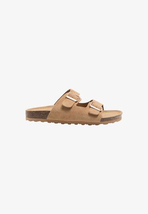 Sandalo slip-on in camoscio color tan con due cinturini regolabili con fibbia e suola in sughero con battistrada in gomma.