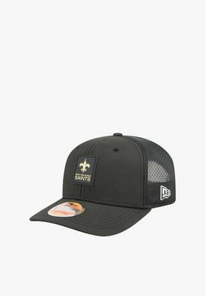 Black cap with a solid front and mesh back, featuring a prominent New Orleans Saints logo patch in gold and black on the front panel.