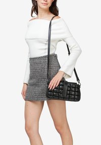Miriade Bolso de mano - nero