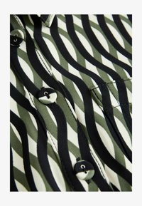 Valitud, green black geo print