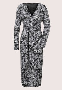 Langärmliges Wickelkleid in Schwarz und Weiß, mit Zebra- und abstraktem Muster, aus einem leichten, glatten Stoff mit einem gebundenen Taillengürtel.