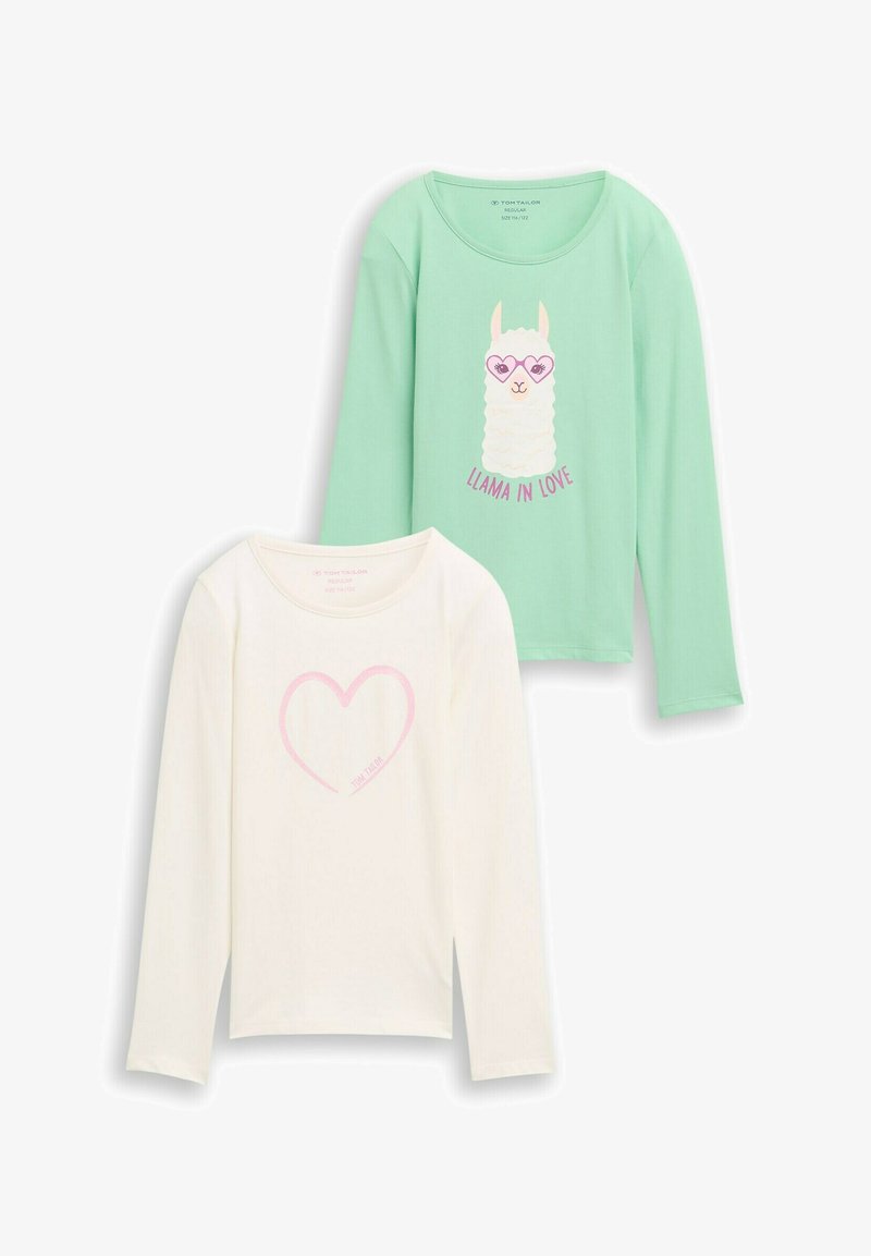 Dva dječja majica s dugim rukavima: jedna mint zelena s llamom koja nosi naočale u obliku srca, a druga kremasta s obrubom ružičastog srca.