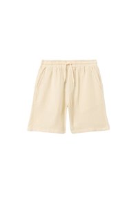 Beige puuvillashortsit, joissa on joustava vyötärö, nyöri ja kaksi sivutaskua; teksturoitu kangas, jossa on herkkä ruutukuosi.