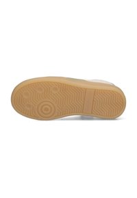 Bodem van een sneaker, met een visgraatpatroon, rubbermateriaal in beige, met een rond detail in het midden en een platte profiel.