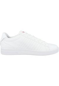 White athletic shoe with a smooth synthetic upper, round toe, and flat sole. Features subtle stitched lines and lace closure. Red logo accent.