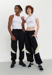 YOURTURN UNISEX - Jogginghose - black