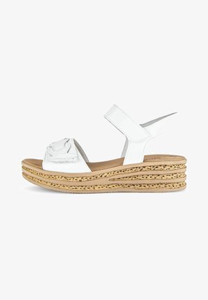 Witte wedge sandalen met een gestructureerde kurken middenzool, featuring een brede band over de voet en een zachte binnenzool voor comfort.