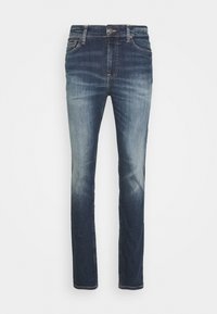 Mörkblå denimjeans med rak passform, ljusare blekning vid låren, fem fickor och knäppning i midjan.