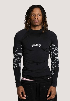 - Bluzka z długim rękawem