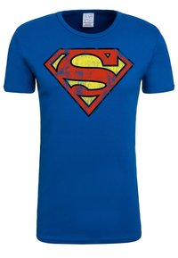 Blue cotton t-shirt with short sleeves featuring a large, distressed red and yellow Superman logo centered on the chest.