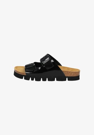 Black patent slide sandal with two adjustable buckles, cork footbed, and textured rubber sole. Features a flat profile and open toe design.