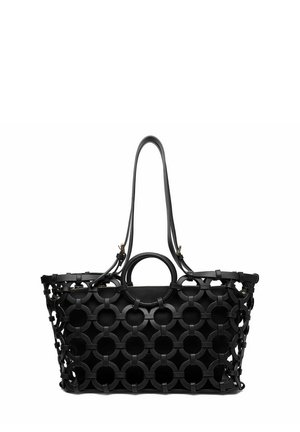 Black tote bag with circular openwork leather overlay and two long shoulder straps with a smaller inner pouch inside.