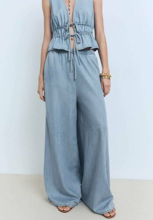 Light blue denim wide-leg pants with a relaxed fit, featuring an elastic waistband and drawstring. Soft texture and minimal stitching details.