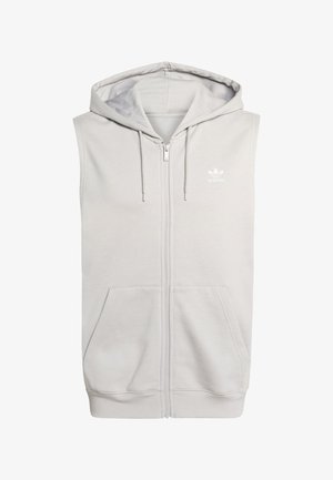 Grå ermeløs hettejakke med frontglidelås, kengurulommer og hette med snor. Har Adidas-logoen i hvitt. Mykt bomullsmateriale.