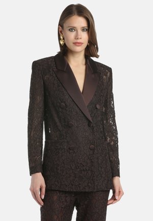 Black lace double-breasted blazer with satin notched collar, decorative buttons, and floral patterns; features long lace sleeves and side pockets.