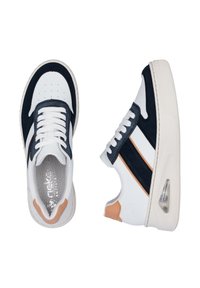 White and navy sneakers with a smooth leather upper, a perforated toe box, contrasting stripes, and a visible air cushion on the sole.