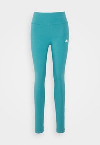 Turkosa tights med hög midja, tillverkade av ett slätt tyg. Har en vit Adidas-logotyp på vänster lår.