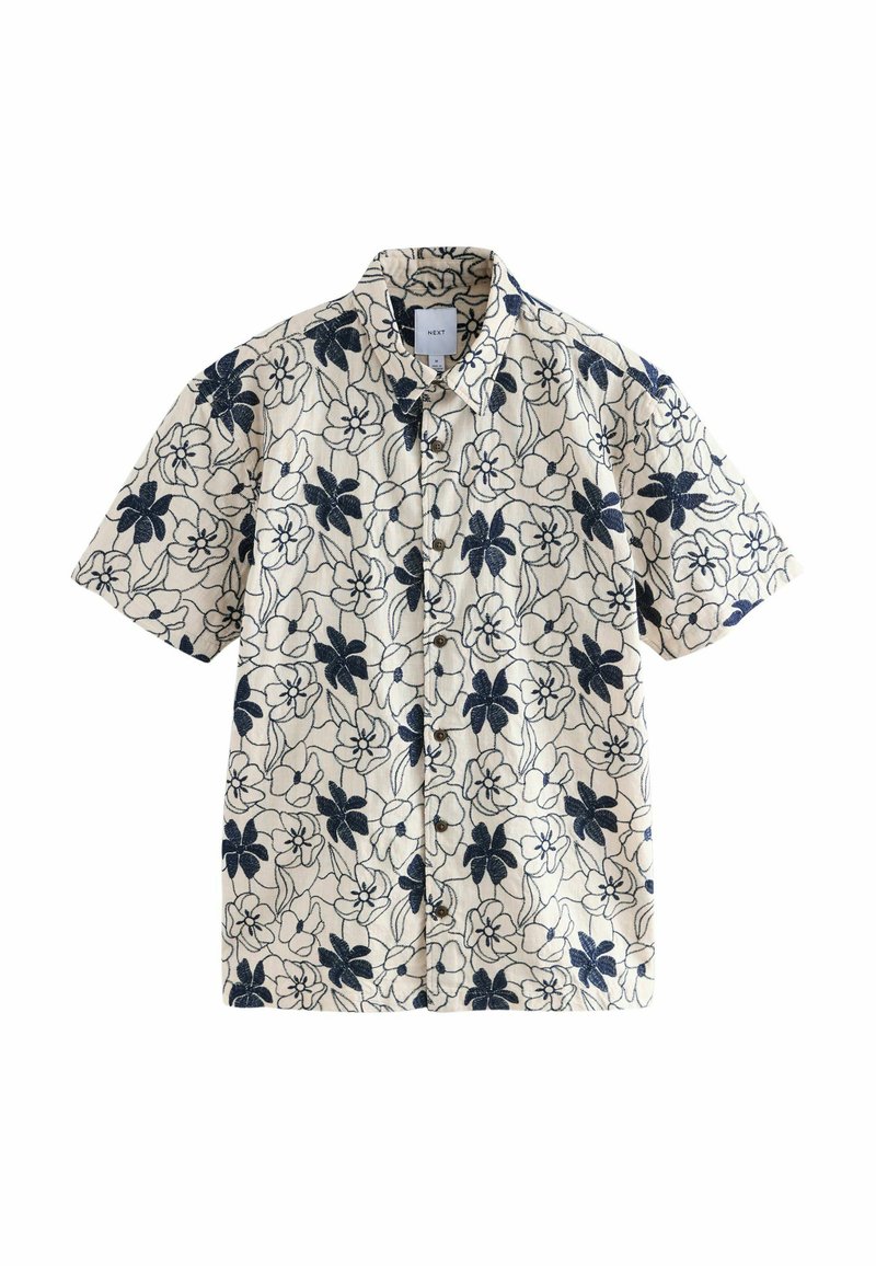 Kurzarmhemd aus beigem Stoff mit einem navyblauen Blumenmuster. Verfügt über eine Knopfleiste und einen Kragen für einen lässigen Sitz.