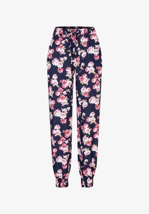 Floral jogger pants made of soft fabric, featuring a navy background with vibrant pink and white flowers, elastic cuffs, and a drawstring waist.