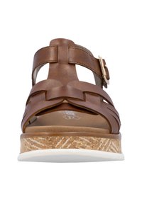 Sandale en cuir marron avec un design tissé, bride de cheville ajustable et semelle en liège avec un bord blanc. Texture lisse et profil plat.