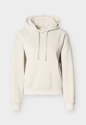 Cream cotton hoodie with a drawstring hood, front pocket, ribbed cuffs, and hem. Features a relaxed fit and smooth texture.