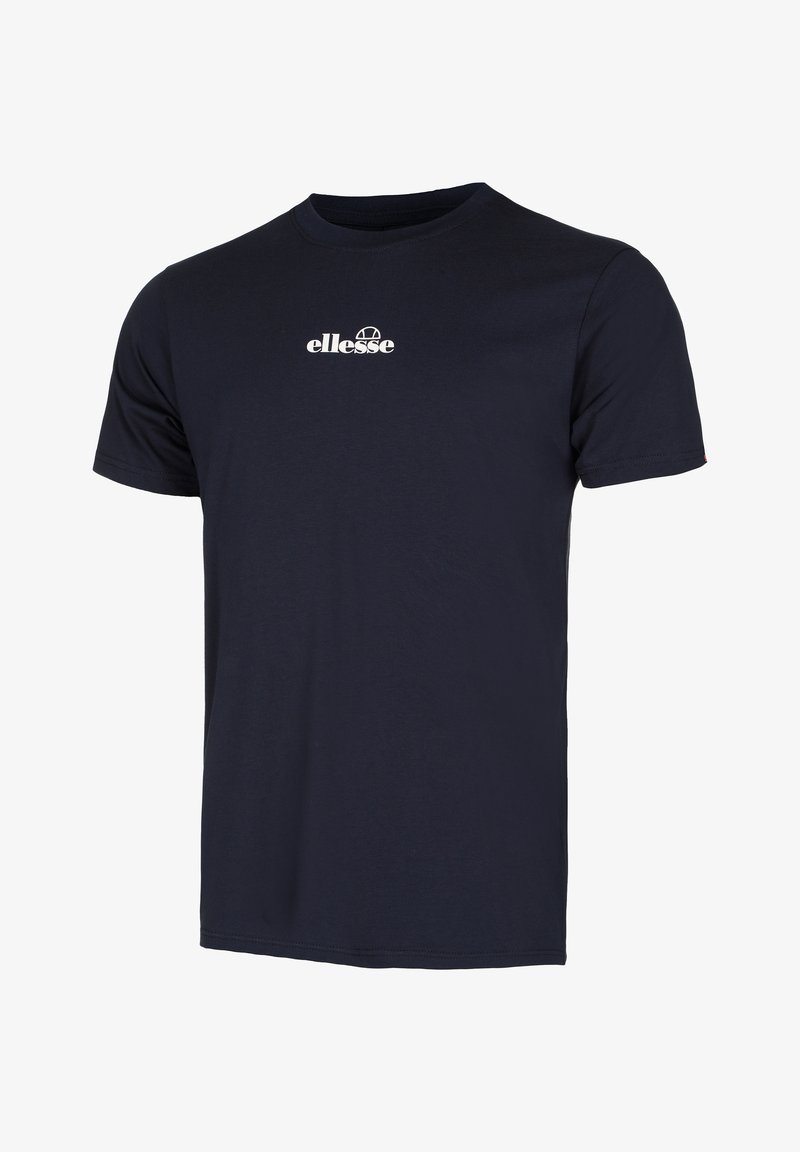 T-shirt de algodão azul-marinho com mangas curtas, gola redonda e o logo "ellesse" em branco no peito. Textura suave, corte clássico.