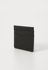 Black card holder made of textured material with a checkerboard pattern, featuring multiple card slots on the front and a sleek design.