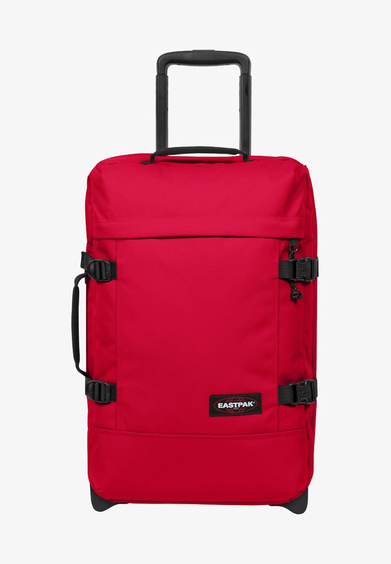 Borsa duffel rossa con ruote, di forma rettangolare, realizzata in tessuto resistente, dotata di spallacci regolabili e manico estraibile.