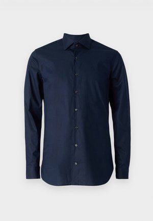 Tumesinine pika varrukaga särg, mis on valmistatud puuvillast, millel on nööpidega esitlus, terav krae ja mustad nööbid ees.