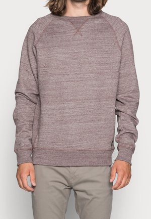 Sudadera color burdeos de tejido texturizado con cuello redondo y mangas raglán. Presenta puños y dobladillo acanalados, con detalles de costura sutiles.
