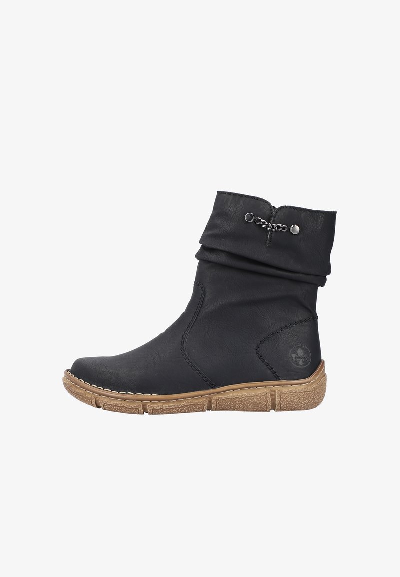 Black ankle boot made of textured leather with a slouchy upper, decorative chain detail, and a light brown rubber sole.