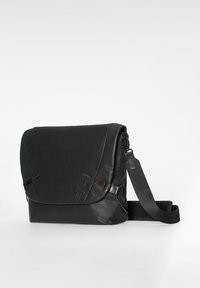 Black leather messenger bag with adjustable shoulder strap and flap closure, shown against a plain white background.