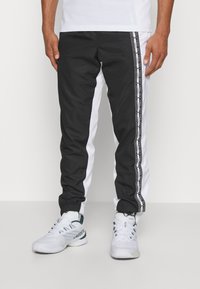 Lacoste Sport TENNIS PANT - Pantalones deportivos - noir/blanc