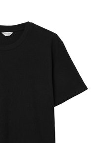 T-shirt in cotone nero con scollatura rotonda, maniche corte e una vestibilità rilassata. Tessuto liscio senza fantasie o decorazioni.