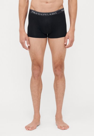 Črne bokserice iz elastičnega materiala, s elastičnim pasom, na katerem je v belem napisu logo "Polo Ralph Lauren".
