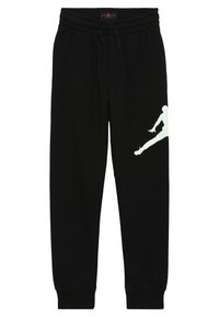 Pantalones de chándal negros con cintura elástica, con un logotipo blanco de Jordan en la pierna izquierda y puños acampanados para un ajuste ceñido.