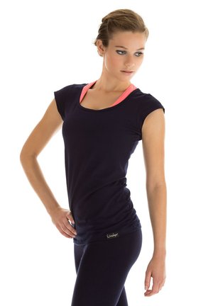 Navy blue athletic top with short sleeves, featuring a pink accent around the neckline. Smooth texture, fitted design, and subtle logo detail.