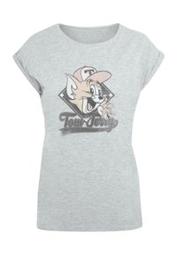 Grå t-skjorte med korte ermer laget av bomull, med et tegneserieillustrasjon av en katt med caps og teksten "Tom og Jerry" i svart.