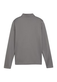 Polo a maniche lunghe di colore grigio medio, realizzato in tessuto morbido con una texture liscia e un collo classico. Senza motivi o accenti visibili.