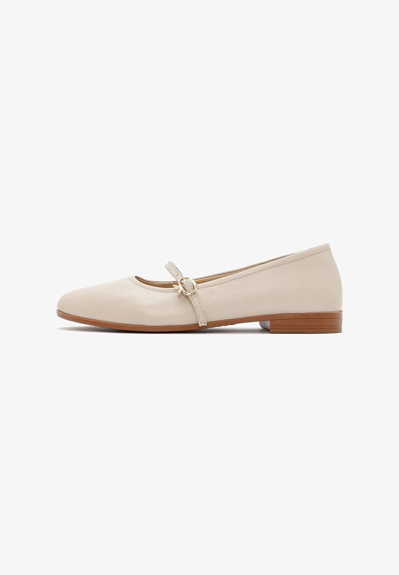 Beige leather ballet flats with a round toe, thin strap with a round buckle, and a low wooden heel. Smooth, minimal design with a subtle sheen.