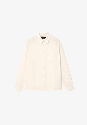 Chemise blanche à manches longues avec boutons, col et poche poitrine, présentée à plat sur un fond blanc.