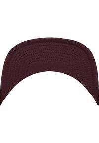 Burgundy cap visor featuring a structured, curved design with stitched details and a smooth, textured fabric surface.