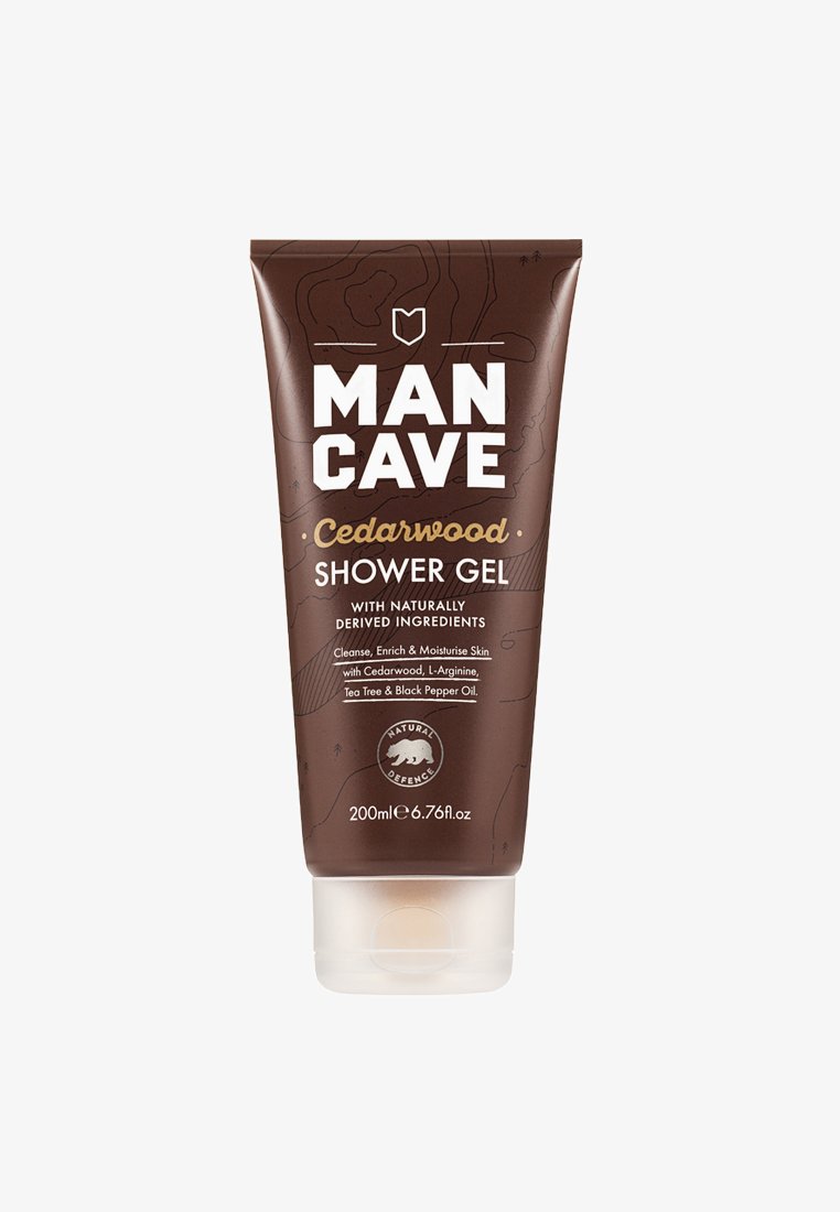 Gel douche en bois de cèdre dans un tube souple marron, avec un texte blanc et un logo d'ours, d'une capacité de 200 ml. Motif de surface texturé visible.