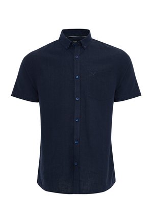 Camisa de manga corta azul marino con botones en tejido ligero. Cuenta con un bolsillo frontal y botones en contraste. Textura suave, diseño de cuello clásico.