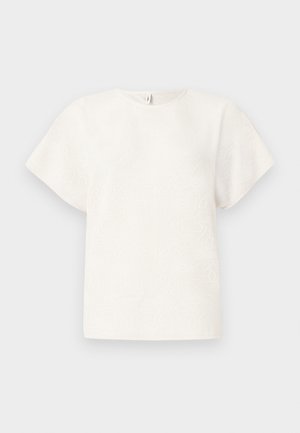 Top bianco a maniche corte con motivo floreale testurizzato. Design semplice con scollo rotondo e vestibilità comoda.